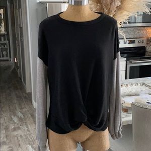 Super soft black top with grey sleeve